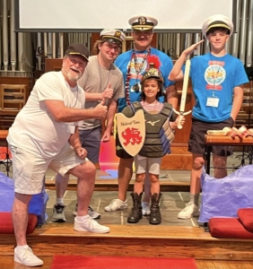 Photo of child putting on the armor of God at VBS!